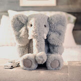 18" Oh So Soft Elephant - Front view of seated gray Elephant in bedroom setting image number 8