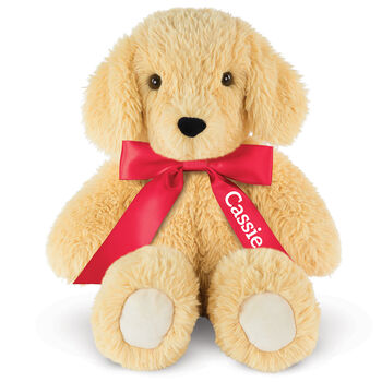 18" Oh So Soft Puppy - Front view of seated tan 18" Puppy with tail and ivory foot pads wearing a red satin bow with tails personalized with "Cassie" in white lettering