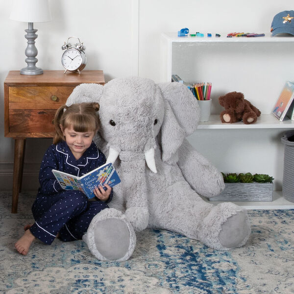 4' Cuddle Elephant - Front view of seated grey plush elephant with child model in bedroom scene