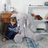 4' Cuddle Elephant - Front view of seated grey plush elephant with child model in bedroom scene image number 5