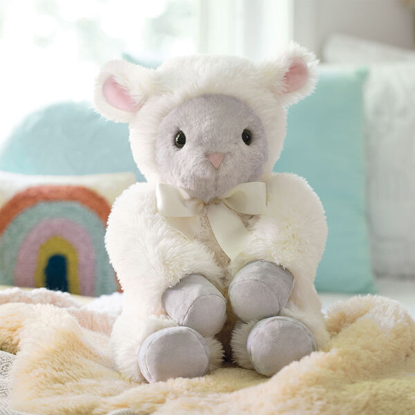 20" World's Softest Lamb - Seated ivory lamb in a bedroom scene