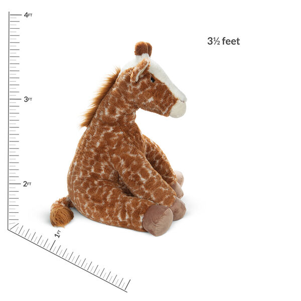 3 1/2' Gentle Giant Giraffe - Side view of seated soft giraffe with measurement of 3 1/2 Feeet