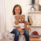 8" Oh So Soft Teddy Bear - Front view of seated honey brown bear in a bedroom scene being held by a girl image number 1