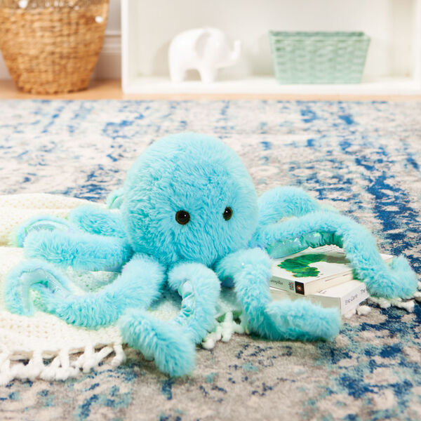 18" Oh So Soft Octopus - Front view of seated turquoise blue octopus in a living room scene image number 1