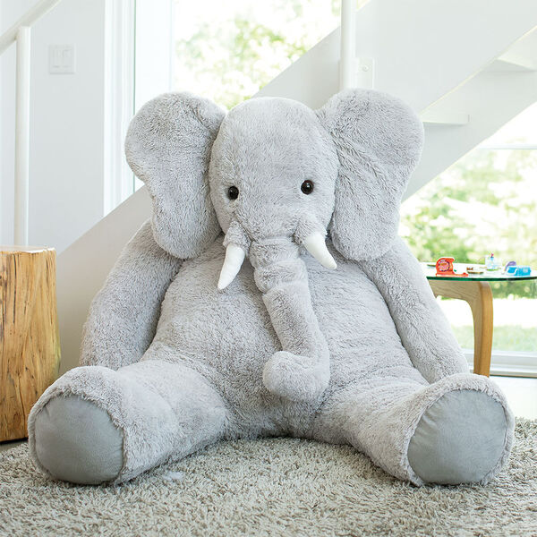 6' Giant Cuddle Elephant - Front view of seated grey plush elephant in a living room scene