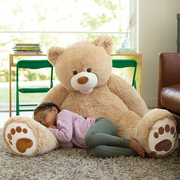 4' Bubba The Teddy Bear - Seated front view of tan bear with child in a living room scene