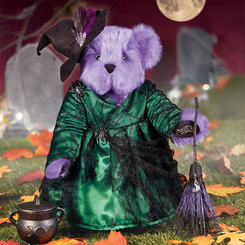 15" Limited Edition Toil and Trouble Witch - Front view of standing jointed purple bear with green dress with black spider web lace, broom, witch's hat and cast iron cauldron in Halloween scene