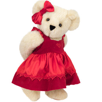 15" Sweetheart Teddy Bear - Three quarter view of standing jointed bear dressed in red velvet and satin dress and hair bow with heart lace trim and heart applique on front of dress - Buttercream brown fur