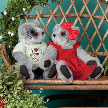 15" Zombie Love Bear - Seated on a bench in a garden jointed bears with blackened eyes, embroidered scars and red heart tattoo on right arms wearing torn t-shirt and jeans and red velvet dress and hairbow - gray fur