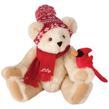 15" Season's Greetings Bear - Front view of seated jointed bear dressed in a knit red and white nordic patterned hat with red scarf and holding a red cardinal. Bottom edge of scarf is personalized with "Lily" in white lettering- Buttercream brown fur