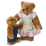 15" Home Is Where Your Mom Is Bear - Front view of standing jointed bear wearing a pink gingham dress, green bow and apron with floral embroidery and says "Home is Where Your Mom Is" presented as a Mother's Day gift image number 2