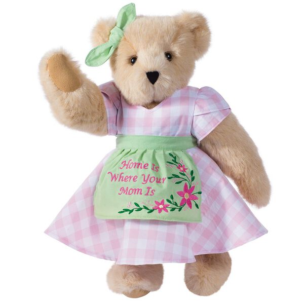 15" Home Is Where Your Mom Is Bear - Front view of standing jointed bear wearing a pink gingham dress, green bow and apron with floral embroidery and says "Home is Where Your Mom Is" - Buttercream brown fur image number 0