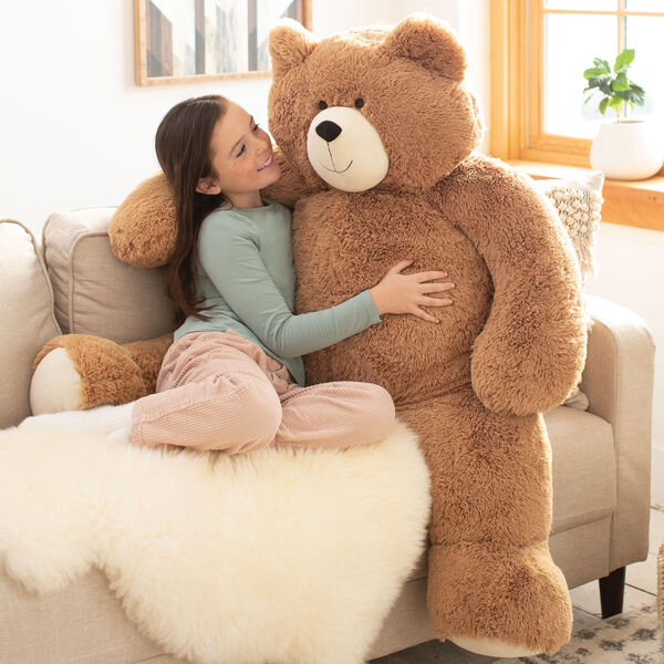 4' Big Hunka Love Bear - Seated golden brown bear with a child on a sofa image number 1
