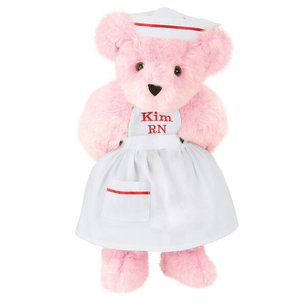15" Nurse Bear - Front view of standing jointed bear dressed in white nurse's dress and hat with red trim perosnlized with "Kim RN" on bib of dress in red - Pink fur