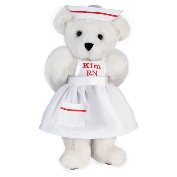 15" Nurse Bear - Front view of standing jointed bear dressed in white nurse's dress and hat with red trim perosnlized with "Kim RN" on bib of dress in red - Vanilla white fur