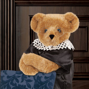 15" Ruth Bader Ginsburg Bear - Standing Honey Bear with blue eyes dressed in a black satin robe, white dissent color and gold wire framed glasses in iconic RBG pose